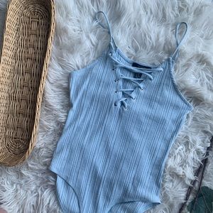 Baby blue lace up body suit size M